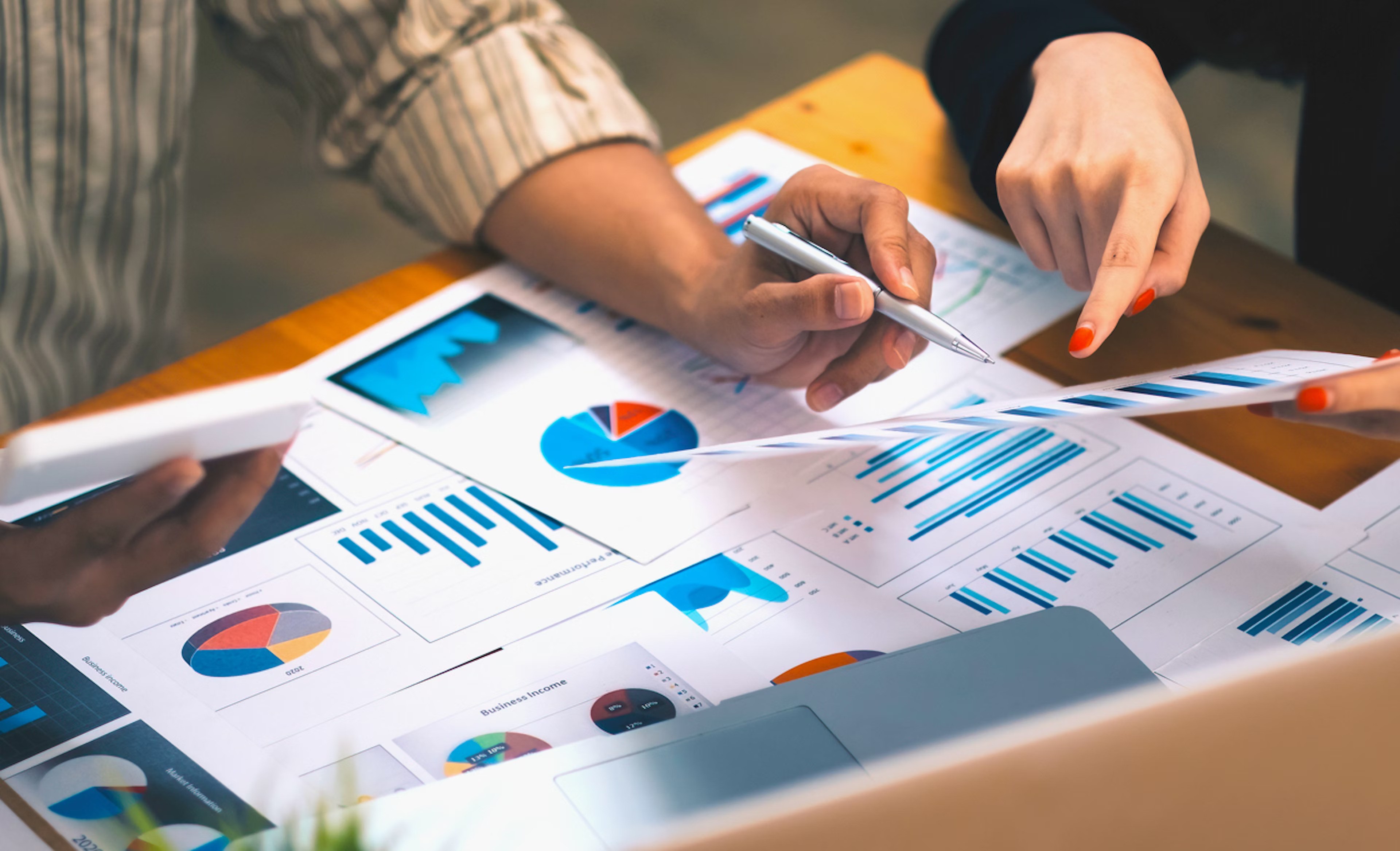 Business professionals analyzing graphs and documents